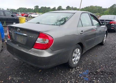 2003 Toyota Camry Le z USA, uszkodzony, nr VIN 4T1BE32K03U700748